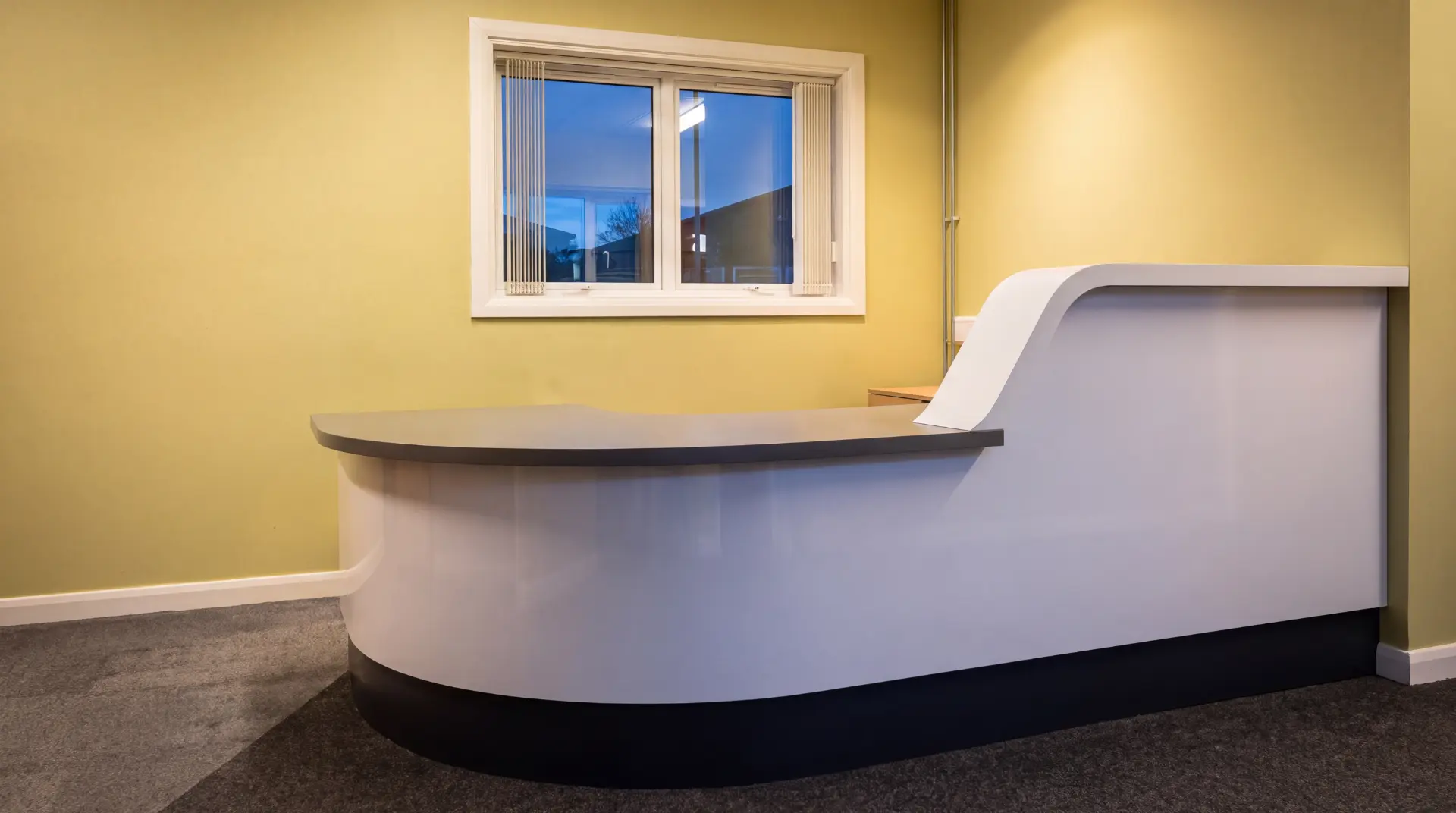 Bespoke timber reception desk in a salon interior